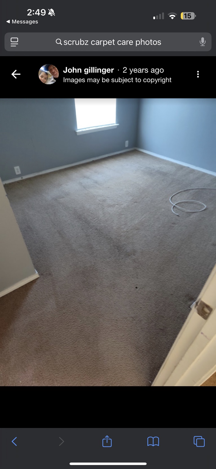 Clean carpeted room with blue wall